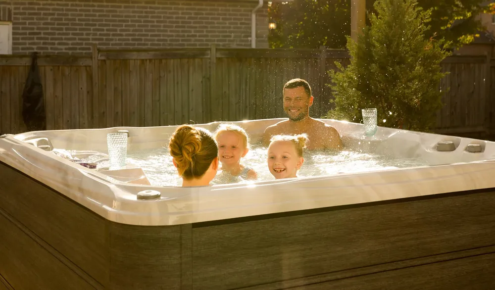 Sundance® Bristol® hot tub, installed in a backyard
