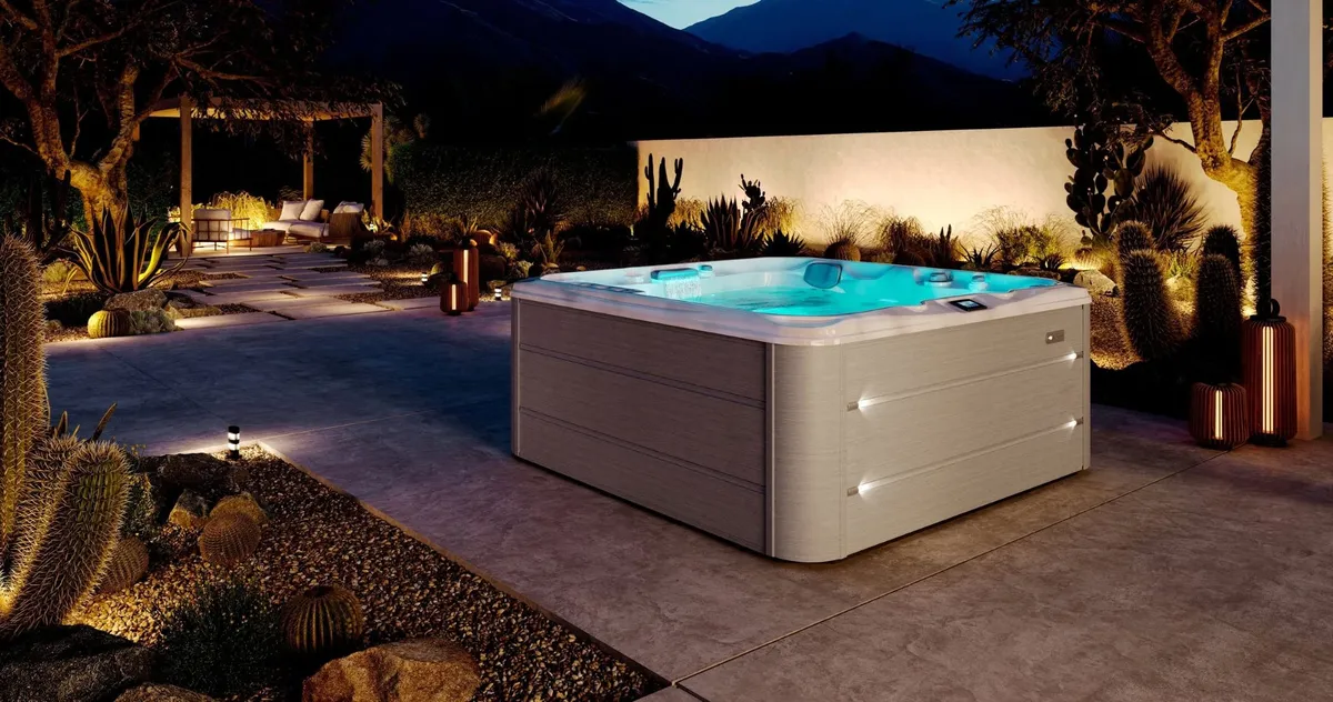 Sundance Spas Hamilton™ hot tub in a backyard